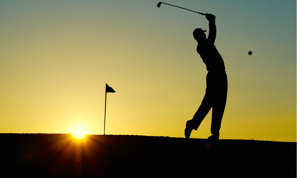 Golfer at sunset representing the beauty of the game